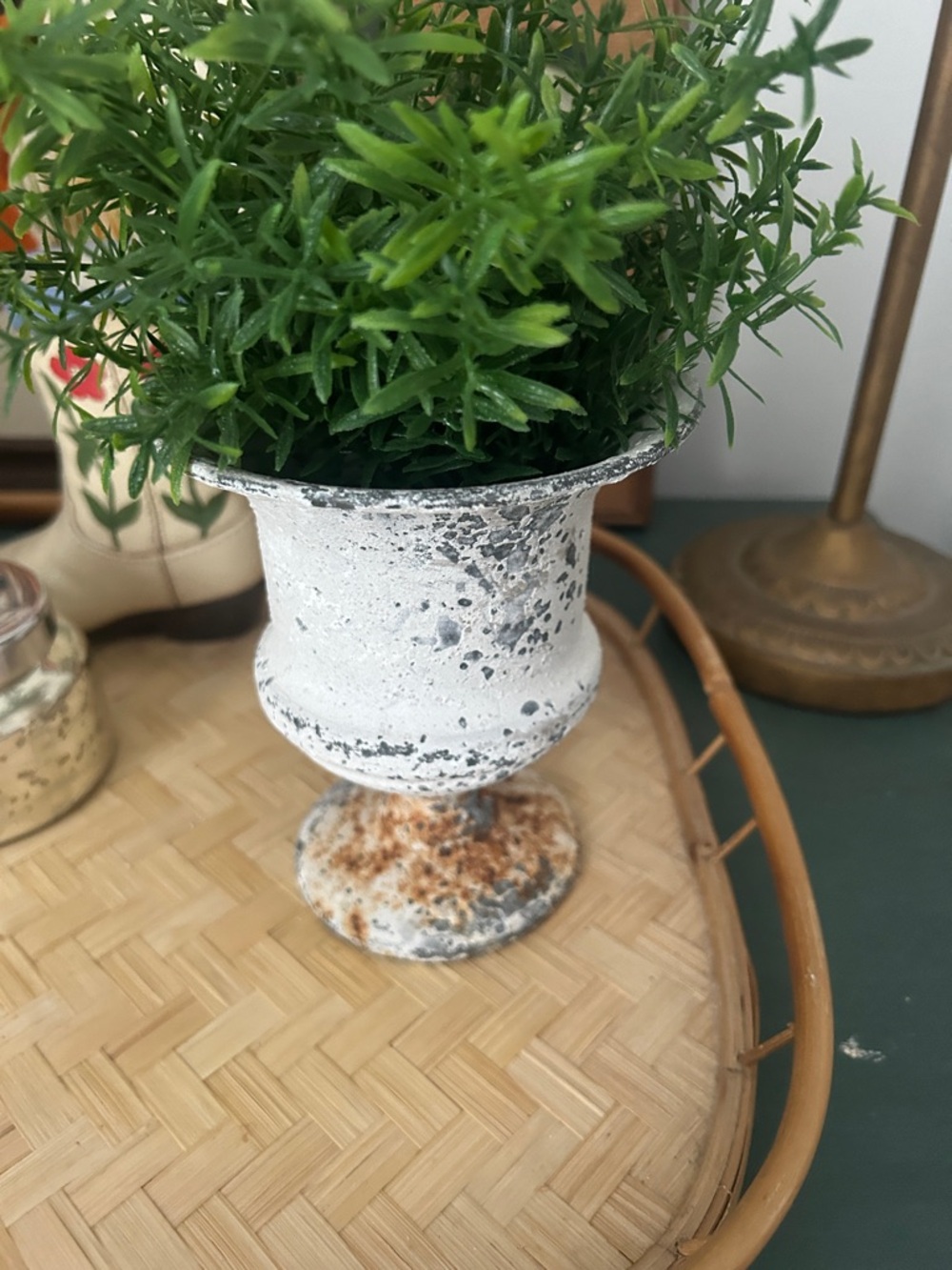 Chippy small metal rusty urn with fake plant